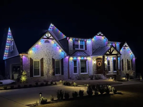 Home lit in blue, purple and gold with permanent color lighting