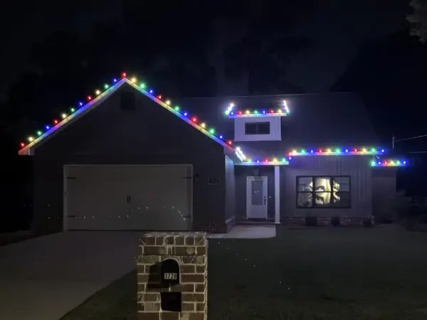 Home with red, green, blue and yellow bulbs along the roofline